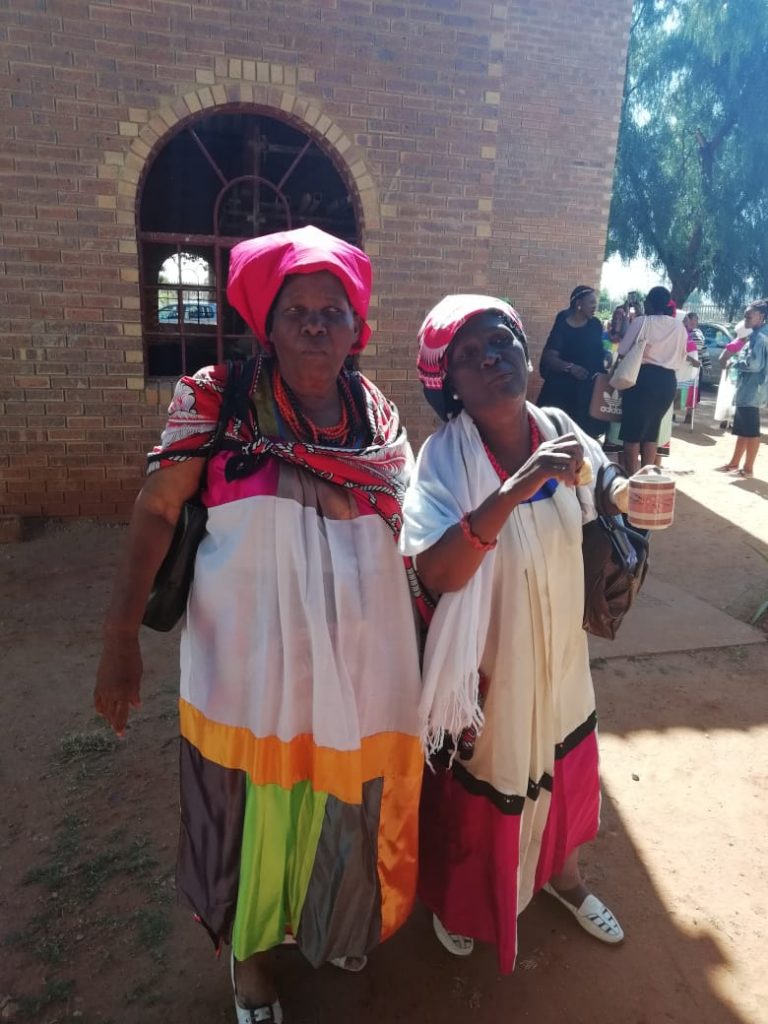 Elderly members in attire made from remnant clothing, sold to raise funds